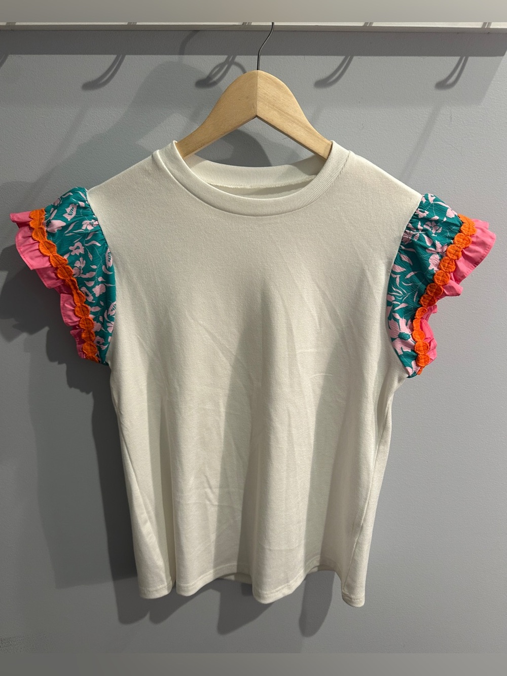 Cream Flutter Sleeve Top with Teal Floral Accent